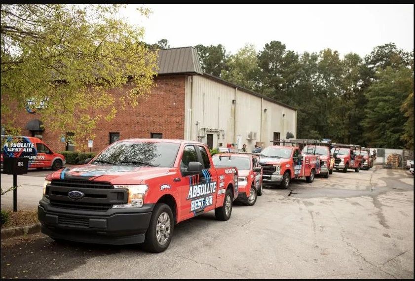 Absolute Best Air service trucks outside the company building