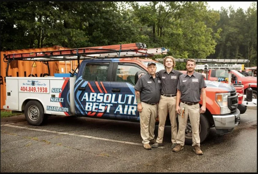 Absolute Best Air service team with branded vehicles